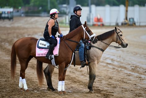 Pass the Champagne makes her way to the muddy track with trainer George Weaver on the pony at Churchill Downs Thursday April 29, 2021 in Louisville, Kentucky
