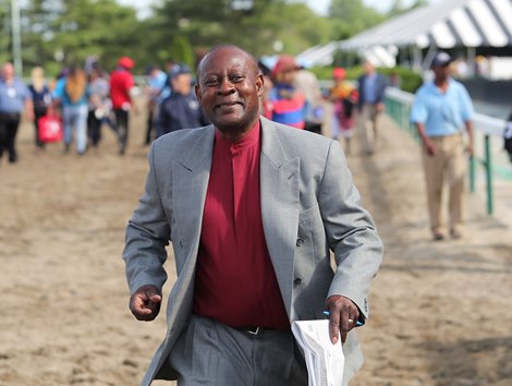 Trainer Uriah St. Lewis runs to the winners circle with a smile after Informative #5 with Jose Ferrer riding won the $150,000 Grade III Salvator Mile at Monmouth Park Racetrack in Oceanport, NJ.  Second was #7 NY Traffic and Paco Lopez.  Photo By Bill Denver/EQUI-PHOTO