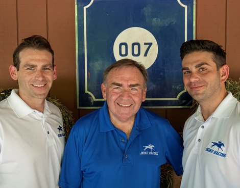 The training team of Team Bond from left to right Ryan Bond, Jim Bond and Kevin Bond gather at their private barn  Monday June 28, 2021 in Saratoga Springs, N.Y. . Photo by Skip Dickstein