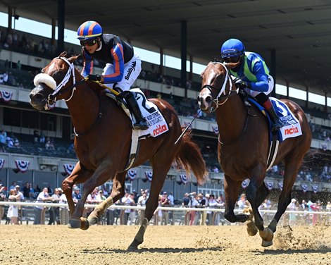 Drain the Clock wins the 2021 Woody Stephens Stakes at Belmont Park