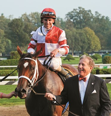 Owner Rick Porter leads the Havre de Grace ridden by Ramon Dominguez to the winners' circle after winning The Woodward's 58th run at Saratoga Speedway in Saratoga Springs, NY September 3, 2011. (Skip Dickstein/Times Union)