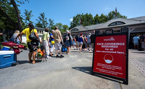 A large crowd gathers at the Whitney Gate on Opening Day of the 153rd meeting at the Saratoga Race Course  Thursday July 15, 2021 in Saratoga Springs, N.Y.