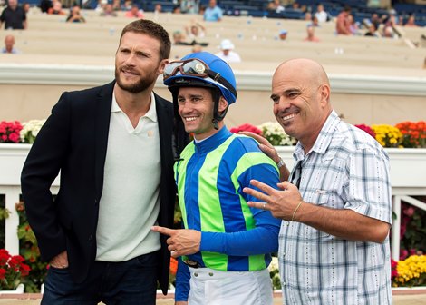Trainer Peter Miller, right, and jockey Flavien Prat, middle, pose for a picture with Scott Eastwood after None Above the Law&#39;s victory in the $175,000 Real Good Deal Stakes, Friday, July 30, 2021 at Del Mar Thoroughbred Club, Del Mar CA.