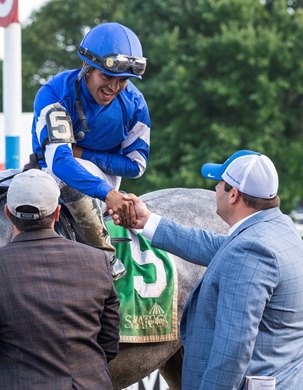 Jockey Luis Saez is congratulated by trainer Brad Cox after winning the 58th running of The Jim Dandy G2 at the Saratoga Race Course Saturday July 31, 2021 in Saratoga Springs, N.Y. 
