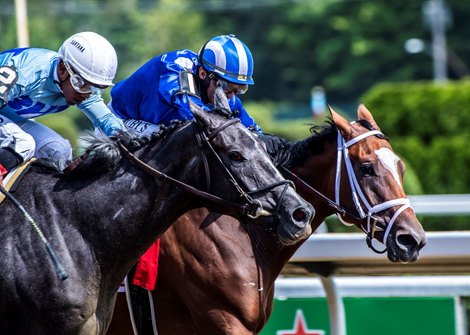 Maracuja with jockey Ricardo Santana Jr., left comes up to beat Malathaat with jockey John Velazquez to the wire to win the 105th running of The Coaching Club American Oaks at The Saratoga Race Course Saturday July 24, 2021 in Saratoga Springs, N.Y.  