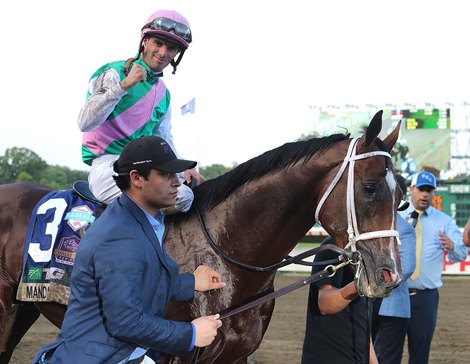 Jockey Florent Geroux celebrates aboard Mandaloun #3 after winning the $1,000,000 Grade 1 Haskell Stakes through disqualification of  Hot Rod Charlie with Flavien Prat at Monmouth Park Racetrack in Oceanport, NJ on Saturday July 17, 2021.  Photo By Bill Denver/EQUI-PHOTO