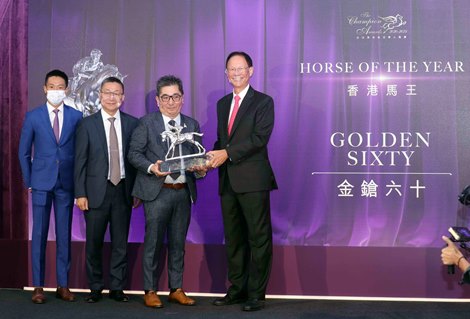 Golden Sixty is crowned Horse of the Year: Mr. Philip Chen, Chairman of The Hong Kong Jockey Club, presents the trophy to owner Stanley Chan Ka Leung; the owner is accompanied by trainer Francis Lui and jockey Vincent Ho