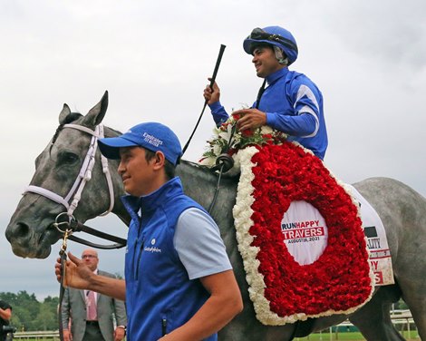 Essential Quality with Luis Saez heading into the Winner&#39;s Circle at Saratoga on August 28, 2021 after the 152nd Running of the Travers (GI). Photo By: Chad B. Harmon