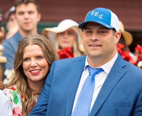 (L-R): Livia Frazar and Brad H.Cox in the winner’s circle after Essential Quality with Luis Saez win the Runhappy Travers Stakes (G1) at Saratoga Race Course in Saratoga Springs, N.Y., on Aug. 28, 2021. 
