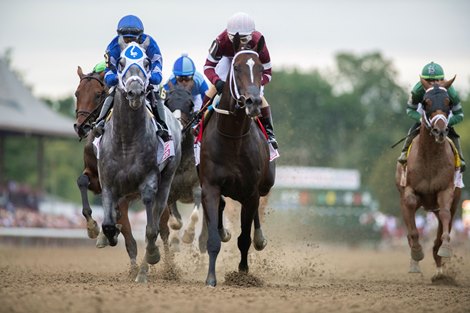 Essential Quality,  with jockey Luis Saez duels with Midnight Bourbon, right to win the 152nd Runhappy Travers Stakes at the Saratoga Race Course Saturday Aug 28, 2021 in Saratoga Springs, N.Y.<br>
