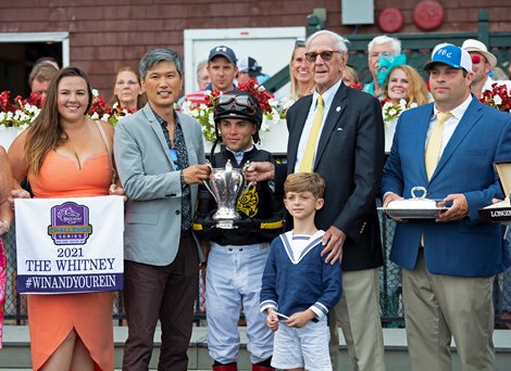 (L-R): Whitney Girl, Korea Authority rep, Joel Rosario, Leverett Miller and grandson Royal Douglass, Brad Cox. Knicks Go with Joel Rosario wins the Whitney (G1). Saratoga racing scenes at Saratoga in Saratoga Springs, N.Y. on Aug. 7, 2021.