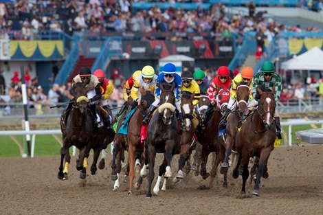 Jockey Irad Ortiz Jr. guides Safe Conduct (Royal blue silks #1)into the 1st turn (middle) to victory in the $1,000,000 Queen's Plate at Woodbine for owner WellSpring Stables and trainer Phil Serpe.