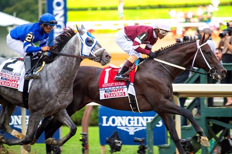 Essential Quality with Luis Saez wins the Runhappy Travers Stakes (G1) at Saratoga Race Course in Saratoga Springs, N.Y., on Aug. 28, 2021. 