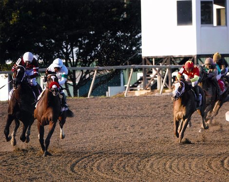 Hot Rod Charlie forces Midnight Bourbon (left) wide during the running of the 2021 Pennsylvania Derby