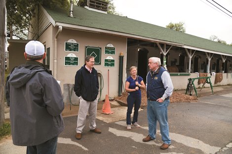 Dr. Richardson and TOBA’s Andy Schweigardt, center, visit with trainers and backstretch workers