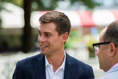 Bloodstock agent Joe Migliore speaks with clients at the Saratoga Race Course Sunday Aug 22, 2021 in Saratoga Springs, N.Y. <br>
