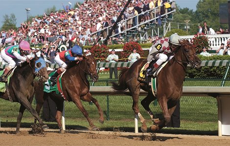 Funny Cide, winning the 2003 Kentucky Derby.