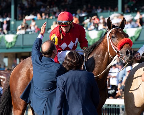 Fausto Gutierrez hugs Ortiz after Letruska with Iran Ortiz jr. wins the Juddmonte Farms Spinser (G1) at Keeneland on Oct. 9, 2021. 