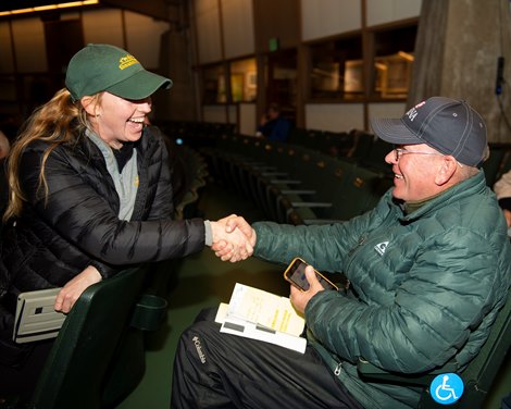 (L-R): Courtney Schneider with Shawhan Place congratulates Eddie Kane with Calumet after the purchase of Hip 3250, a colt by Tapwrit out of Delavie.<br><br />
Horses, people and scenes at the Keeneland November Breeding Stock Sale in Lexington, Ky., on Nov. 17, 2021.  