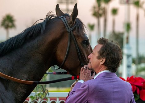 Owner Jim Rome has a moment with Straight Up G in the winner's circle after their victory in the $100,000 King Glorious Stakes, Sunday, December 12, 2021 at Los Alamitos Race Course, Cypress CA.<br><br />
© BENOIT PHOTO