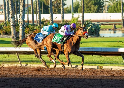 Reddam Racing's Slow Down Andy and jockey Mario Gutierrez, right, win the $300,000 Los Alamitos Futurity G2 on Saturday, December 11, 2021 at Los Alamitos Racecourse, Cypress, CA. 