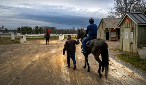 Trainer Kerry Metivier leads Napoleon Complex with exercise rider Jorge Castro aboard as his horses took to the track for the first time this season as the Oklahoma Training Center opened for training Saturday Apr. 17, 2022 in Saratoga Springs, N.Y.    Photo by Skip Dickstein