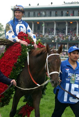 Smarty Jones with Stewart Elliott up wins the Kentucky Derby. Breeder/Owner Patricia Chapman of Someday Farm and her husband Roy, trainer John Servis and wife Sherry and son Tyler.