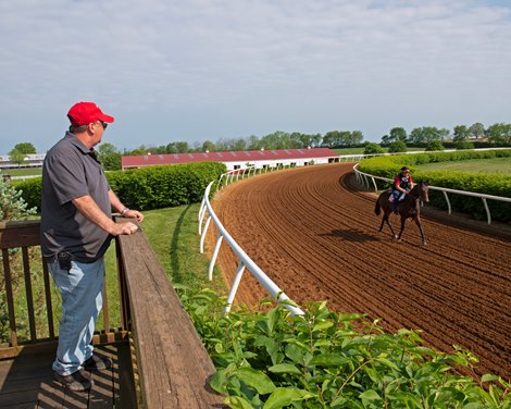 Eric Reed watching a horse train. Rich Strike, Eric Reed and family at Mercury Equine Center in Lexington, Ky., May 11, 2022.