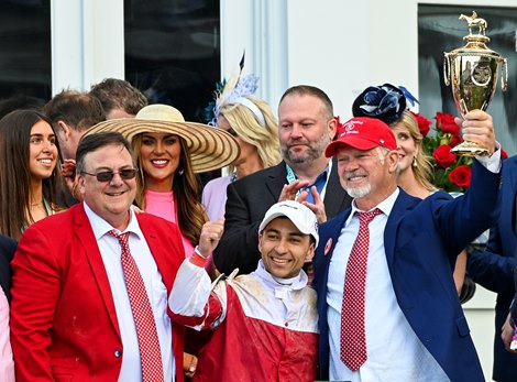 (L-R): Eric Reed, Sonny Leon and Rich Dawson in the winners circle after Rich Strike’s win of the Kentucky Derby (G1) at Churchill Downs in Louisville, KY on May 7, 2022.