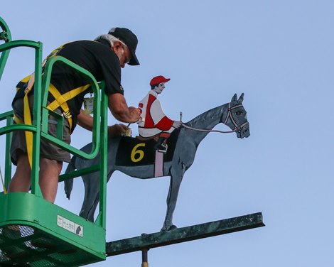 Dick Hageman paints the weathervane at Pimlico Race Course following Early Voting winning the Preakness Stakes