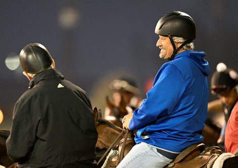 Trainer Steve Asmussen out on his lead pony on track during training hours at Churchill Downs Race Track Wednesday May 4, 2022 in Louisville, KY.  