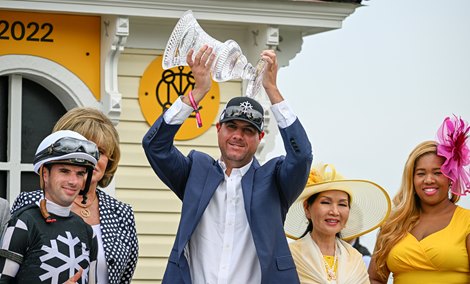 Owner Stanton Flurry holders the winners trophy aloft after Interstatedaydream with jockey Florent Geroux wonthe 98th running of The Black-Eyed Susan at Pimlico Race Course Friday May 20, 2022 in Baltimore, MD.  Photo by Skip Dickstein