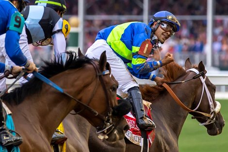 Luis Saez, atop Secret Oath, gestures after winning the 148th running of the Kentucky Oaks at Churchill Downs in Louisville, Ky., on Friday, May 6, 2022.  