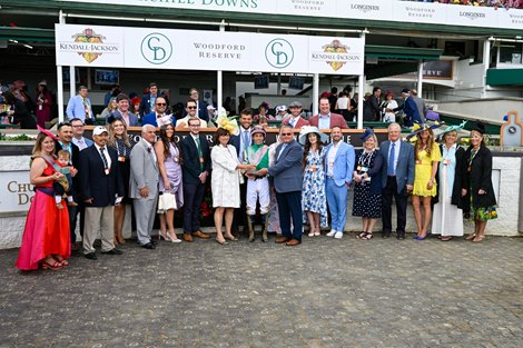 Obligatory's connections celebrate the victory in the Derby City Distaff (G1) at Churchill Downs