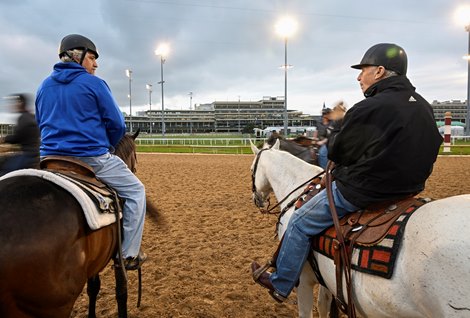 Trainer Steve Asmussen out on his lead pony left chats with trainer D. Wayne Lukas during training hours at Churchill Downs Race Track Wednesday May 4, 2022 in Louisville, KY.