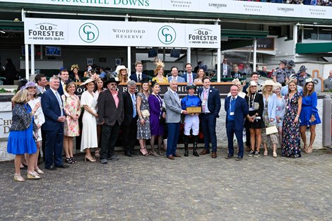 Santin's connections celebrate winning the Turf Classic (G1T) at Churchill Downs.