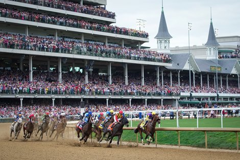 The field of horses rounds turn one during on the day of the 148th Kentucky Derby at Churchill Downs in Louisville, Ky., Saturday, May 6, 2022.