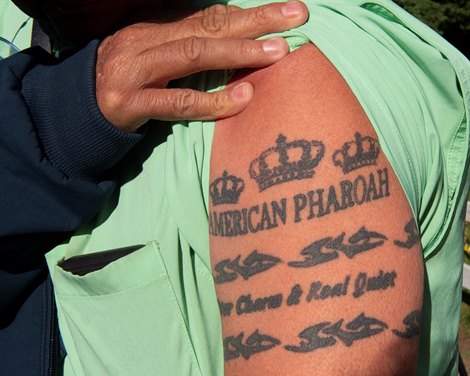 Kevin McKathan with his tattoos in honor of American Pharoah, Silver Charm and Real Quiet Preakness coverage at Pimlico Racecourse on May 18, 2022.