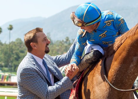 Trainer Michael McCarthy, left, celebrates with jockey Irad Ortiz, Jr., right, after There Goes Harvard&#39;s victory in the Grade I, $400,000 The Hollywood Gold Cup, Monday, May 30, 2022 at Santa Anita Park, Arcadia CA.<br><br />
&#169; BENOIT PHOTO