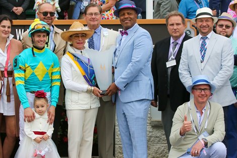 Stolen Base's connections celebrate the win in the American Turf Stakes (G2T) at Churchill Downs
