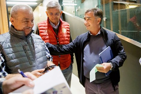 Marco Bozzi (right) with the team of Prince Saud bin Salman Albdulaziz after signing for the top lot on day one of the 2022 Arqana Summer sale