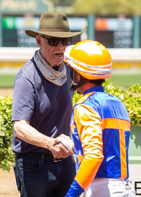 Co-owner Michael Talla, left, celebrates with jockey Ramon Vasquez, right, in the winner's circle after Stone Silent's victory in the $100,000 Fasig-Tipton Debutante, Saturday, June 18, 2022 at Santa Anita Park, Arcadia CA.