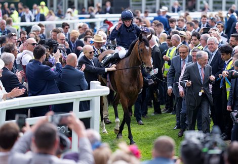 Tuesday (Ryan Moore) are led in after The Oaks Epsom 3.6.22 Pic: Edward Whitaker