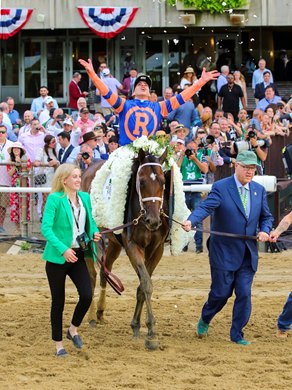 Jerry Crawford (R) walks Mo Donegal with Irad Ortiz Jr. after winning the Belmont Stakes (G1) at Belmont Park in Elmont, NY on June 11, 2022.