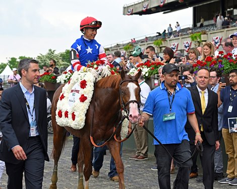 Trainer Chad Brown on right. Jack Christopher with Jose Ortiz wins the Woody Stephens Presented by Mohegan Sun (G1) at Belmont Park on June 11, 2022.