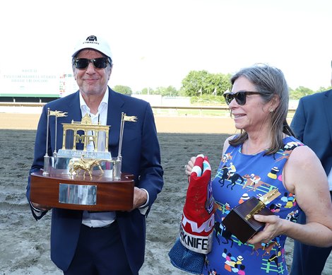 Owner Al Gold and wife Hilary with the Haskell Trophy after Cyberknife won the $1,000,000 Grade I Haskell Stakes at Monmouth Park Racetrack in Oceanport, NJ on Saturday July 23, 2022