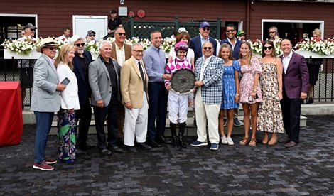 Jockey Flavien Prat is entered in the winner's circle by Rockempang's connection after winning The Bowling Green's 64th run at Saratoga Racecourse on Sunday, July 31, 2022 in Saratoga Springs NY Special photo for Times Union by Skip Dickstein