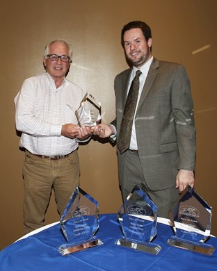 Canterbury Park Hall of Fame - Class of 2015 for Outstanding Contributor - Andrew Offerman (right) presents trophy to Dr. Richard Bowman