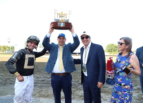 Coach Brad Cox won the Haskell Cup with Jockey Florent Geroux (L) and Owner Al Gold and his wife Hilary (R) after Cyberknife won $1,000,000 in Class I Haskell Shares at Monmouth Park Raceway in Oceanport, NJ on Saturday, July 23, 2022