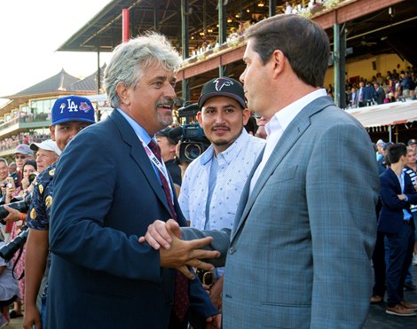 Steven M. Asmussen and Ron Winchell in the winners circle after Epicenter with Joel Rosario win the Runhappy Travers Stakes (G1) at Saratoga Race Course in Saratoga Springs, N.Y., on Aug. 27, 2022.